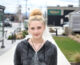 Blonde haired girl posing for a picture.